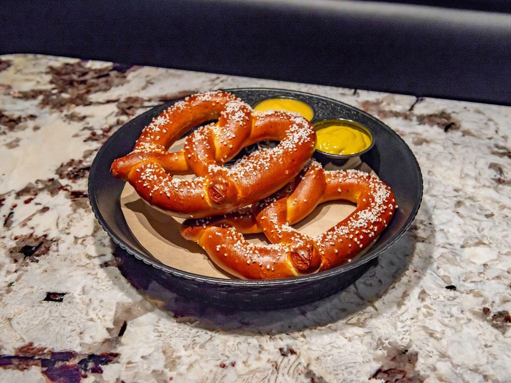 2 Soft Pretzels · 2 large soft pretzels served with choice of nacho cheese, honey mustard, or mustard.