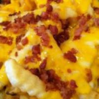 Bacon Cheese Fries · Your choice of our fried crinkle cut fries or seasoned potato wedges. Topped with melted che...