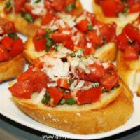 Homemade Bruschetta · Toasted bread, diced tomatoes, onions, basil, virgin olive oil and balsamic vinegar.