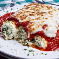 Eggplant Rollatini · Fresh eggplant rolled with whole milk ricotta and topped with melted mozzarella cheese and f...