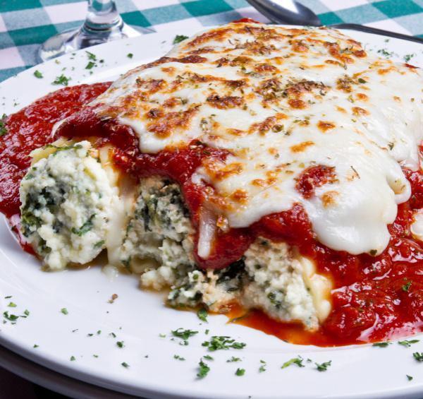 Eggplant Rollatini · Fresh eggplant rolled with whole milk ricotta and topped with melted mozzarella cheese and fresh tomato sauce.