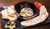 Dip All Hummus · Assorted spreads, dips, tortilla chips and focaccia bread.
