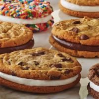 Double Doozie · A sandwich of two of our fresh cookies of your choice, around our classic vanilla frosting.
...