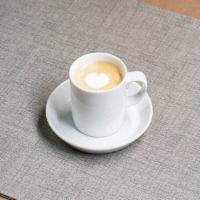 Macchiato · Equal layered parts of Parlor Coffee double espresso, steamed whole milk and micro-foam.