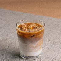 Iced Cortado · 2oz of whole milk and a Parlor Coffee double espresso base, served over ice.