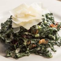 Kale Caesar Salad · Shaved Tuscan kale with herbed croutons, shaved Parmigiano with buttermilk Caesar dressing.