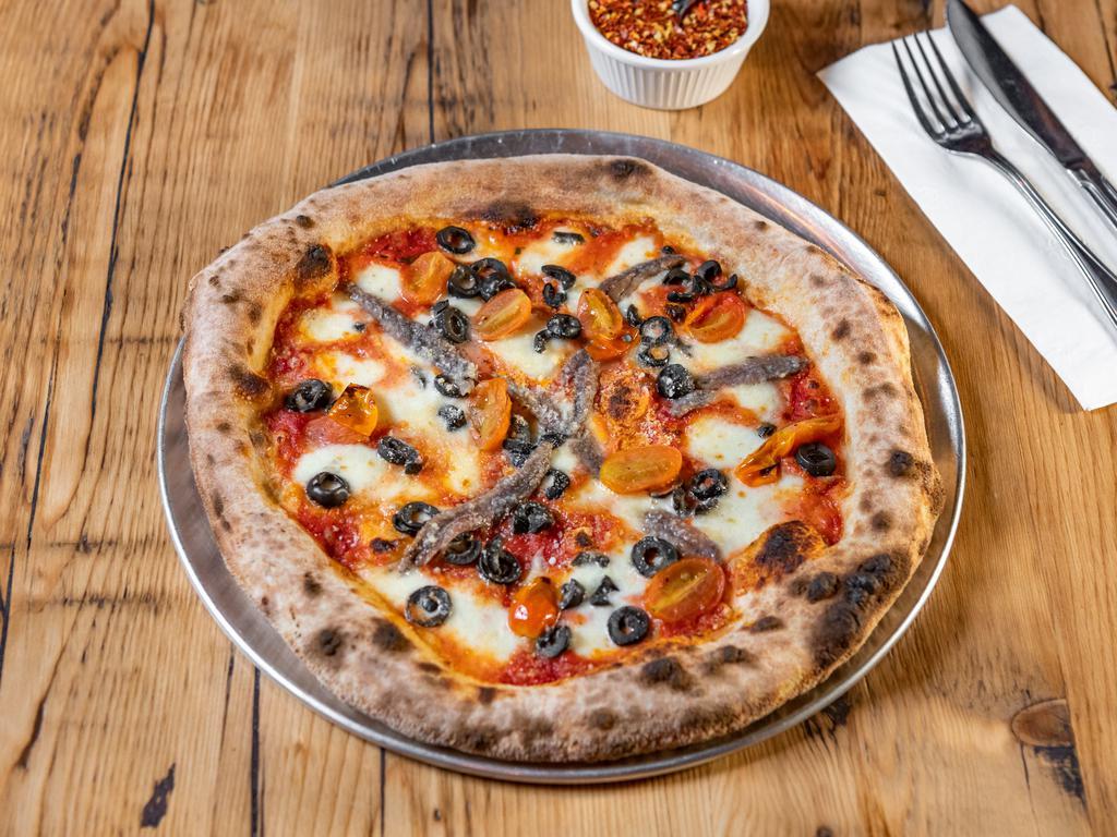 Napolitana Pizza · Fior di latte mozzarella, roasted cherry tomatoes, anchovies, black olives.