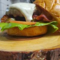 Cowboy Cheeseburger  · Butter lettuce, tomato, grill onion, bacon,pickle jalapeno, Alabama white sauce, and gouda. 