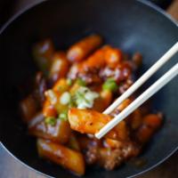 Dduk Bokki · Rice cake sauteed in a spicy red chili pepper sauce (vegetarian or beef).