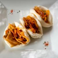 Bo Sam Buns · Steamed buns with pork belly, spicy shredded pickled daikon and sweet soy