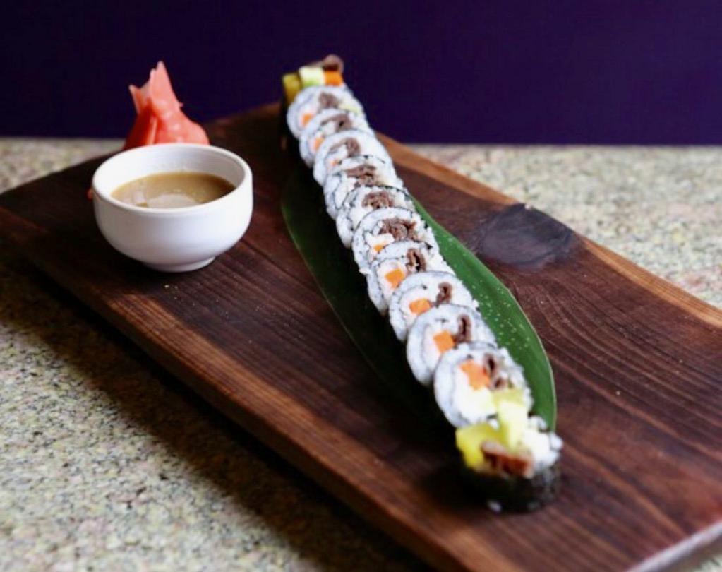 Kimbap (beef) · Korean style cut sushi roll with beef bulgogi and assorted vegetables.