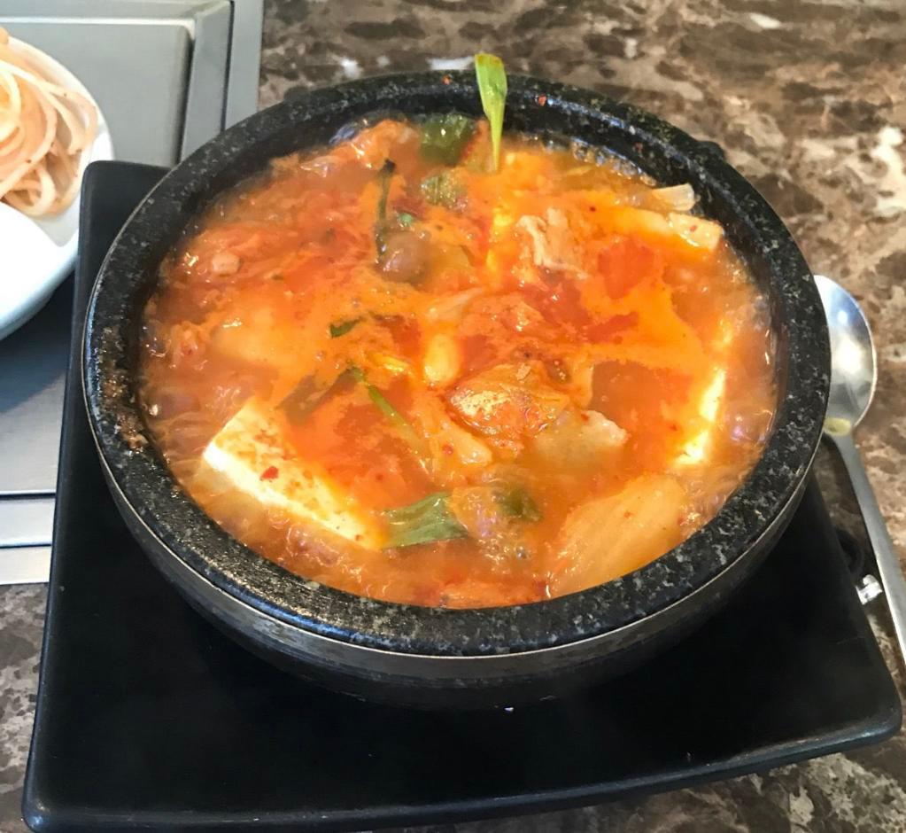 Kimchi Chige · Spicy kimchi stew with pork belly, tofu, onion and scallion