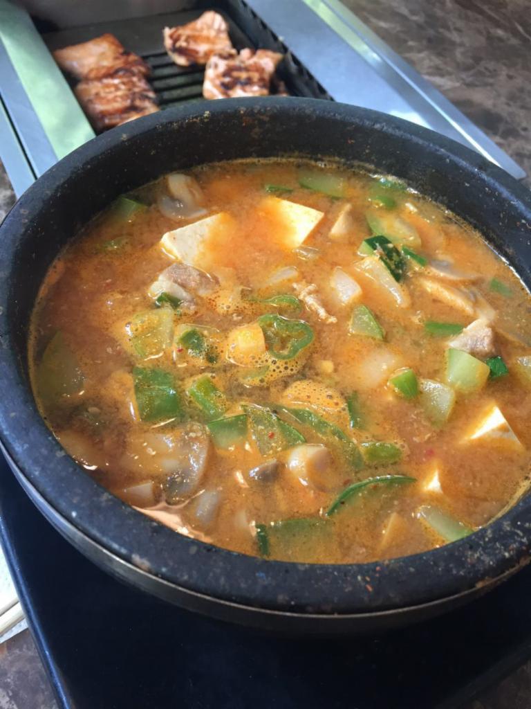 Den Jang Chige · Spicy miso stew with diced tofu, pork, zucchini, onion and green chili
