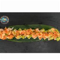 Sunshine Roll · Shrimp tempura, spicy crab. Top: salmon, avocado, thin sliced lemon, cucumber salsa, spicy m...