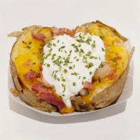 King Potato · Shredded cheddar cheese, bacon, sour cream and chives.
