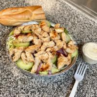 Grilled Chicken Salad · Lettuce, Tomatoes, Onions, Green Peppers & cucumbers, Topped with Grilled Chicken. Served Wi...