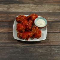 Wings · Cooked wings of a chicken coated in Buffalo sauce. 