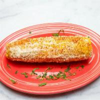 Elotes Callejeros · Fresh boiled corn rubbed with mayo, topped with tajin and cotija cheese. 