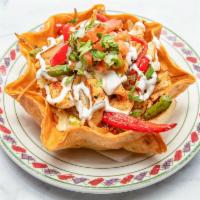  Ground Beef Taco Salad · Deep fried flour tortilla, stuffed with rice, refried pinto beans, mixed peppers and onion, ...
