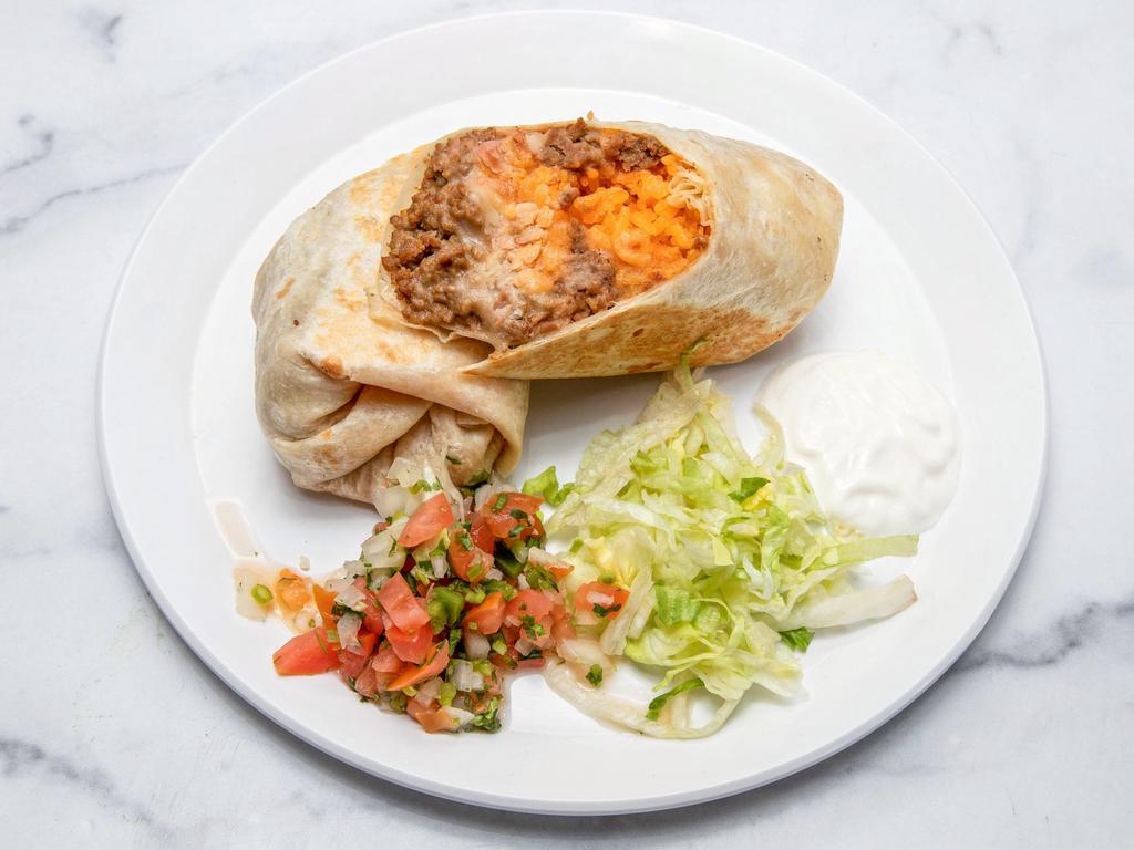 Pollo Burrito · Grilled marinated chicken. Flour tortilla stuffed with rice, cheese, and refried pinto beans. Accompanied with lettuce, pico de gallo, and sour cream.