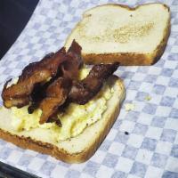 Breakfast Sandwich · Bacon or sausage with fried egg and cheese on sliced bread 