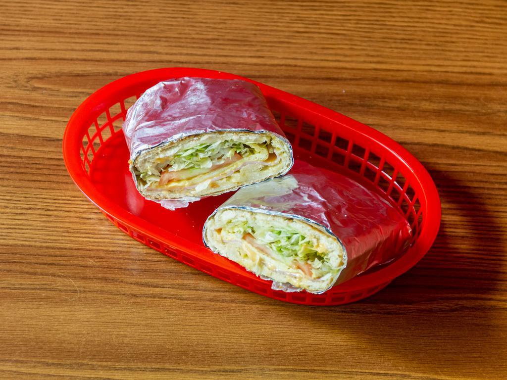 Sandwich Torpedo · Egg sandwich. Egg, ham, cheese, lettuce, tomato. With butter