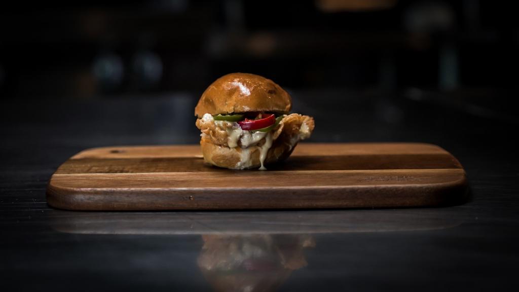 The Urban Cowboy · Crispy chicken breast slider with queso, fresh jalapenos, and our texsauce.