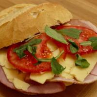 Black Forest Ham and Aged Cheddar Cheese Sandwich · Black forest ham, aged cheddar cheese, tomato, arugula.