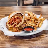 The Stranger Burger · Apple-wood bacon, cheddar cheese, crispy onions, coated in house-made BBQ sauce.