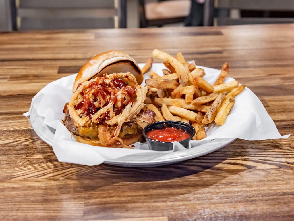 The Stranger Burger · Apple-wood bacon, cheddar cheese, crispy onions, coated in house-made BBQ sauce.