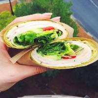 Turkey Wrap · Roasted turkey, roasted red peppers, avocado, hummus, pickled red onions, lettuce wrapped in...