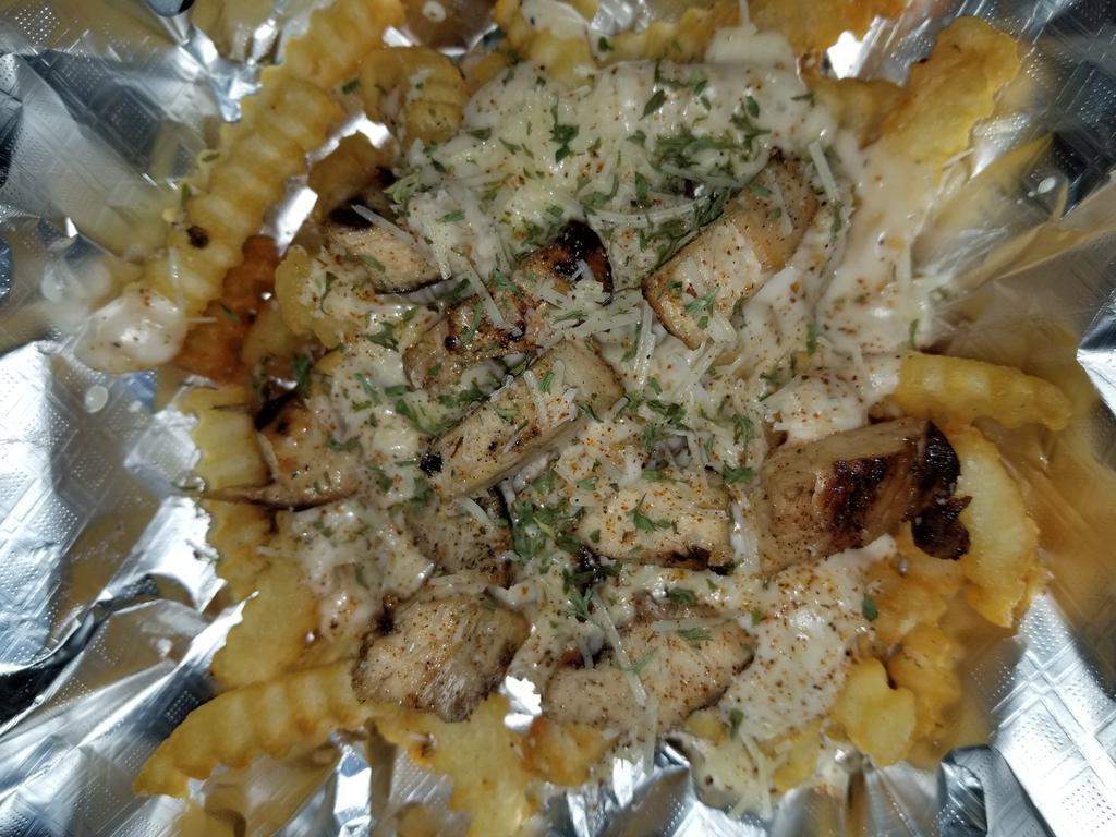 Loaded  fries · French fried potatoes covered in creamy Alfredo, topped with your choice of grilled shrimp or cheddar,  bacon and ranch. Please specify in the notes