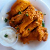 Buffalo Wings · Zesty chicken wings served in your choice of sauce with Bleu Cheese for dipping on the side....