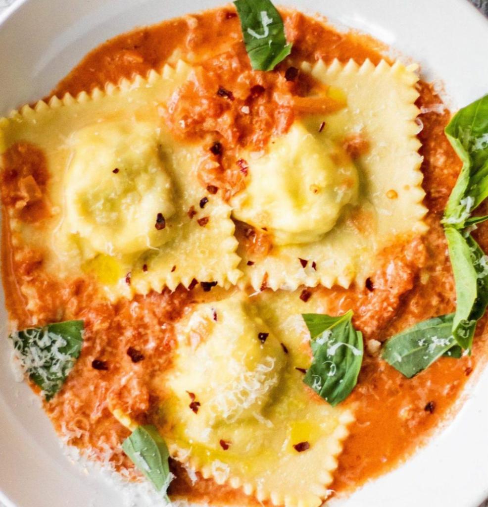 Baked cheese ravioli · Served with bread and butter