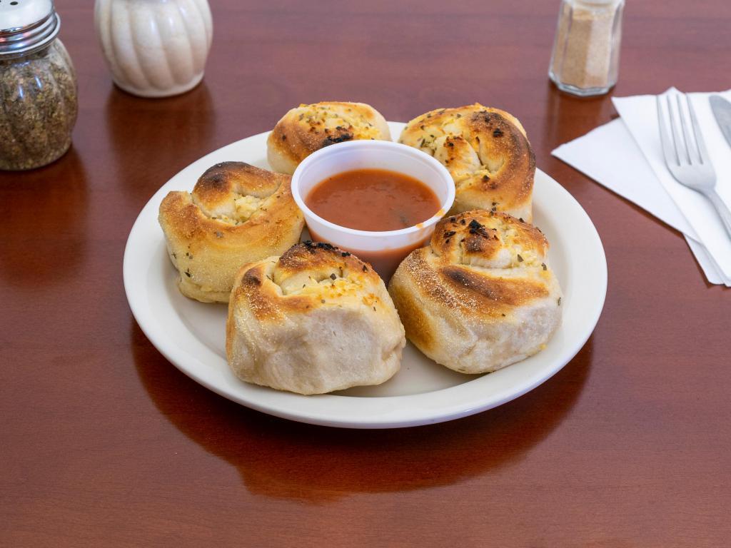 Garlic Knots · 6 pieces. A classic snack, our garlic knots are strips of pizza dough tied in a knot, baked, and then topped with melted butter, garlic, and parsley.