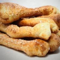 Bread Sticks · Our scratch dough lightly baked then brushed with homemade garlic butter, sprinkled with gar...