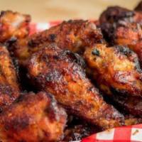 Hickory Smoked Wings · Seasoned with our house rub then hickory smoked for hours and tossed in your choice of sauce...