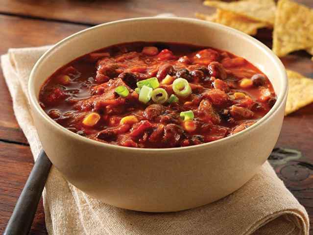 Three Bean Chili · Pinto beans, red chili beans, black beans, sweet corn, bell peppers, and green chilies in slow-simmered tomatoes and Southwestern spices.