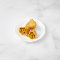 Meat Samosa · 2 pieces. Crispy turnover filled with seasoned minced lamb and green peas.