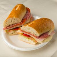 60. Italian · Ham, salami, pepperoni, provolone cheese, lettuce and tomato, roasted peppers, oil and vineg...