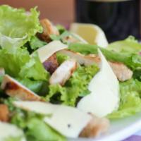 Caesar · Romaine lettuce, shaved parmesan cheese & croutons.