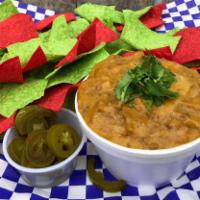 Chips & Queso · 8 oz. Melted Cheddar Cheese with Ground Beef & a secret Recipee  with  Organic Chips made ou...