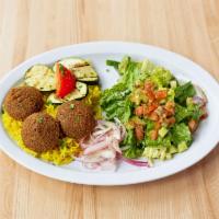 Vegetarian Platter · Falafel, hummus, baba ghanouj, grilled tomato, onion and zucchini, and your choice of salad.