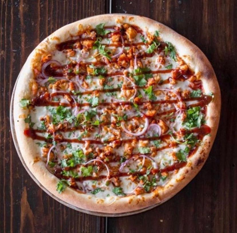 BBQ Chicken Pizza Large · Sauce, mozzarella cheese, BBQ chicken, cilantro, and red onion, topped off with a drizzle of our smoked BBQ sauce drizzle.