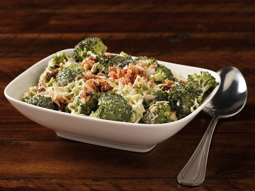 Broccoli Supreme · Broccoli florets blended with raisins, sunflower seeds, bacon bits & lightly coated with a sweet creamy dressing.