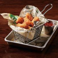 Cheese Curds · Crispy cheese curds served with tomato jam.