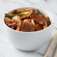 Mongolian Beef · Marinated sliced beef paired with yellow onions and scallions in Mongolian sauce.