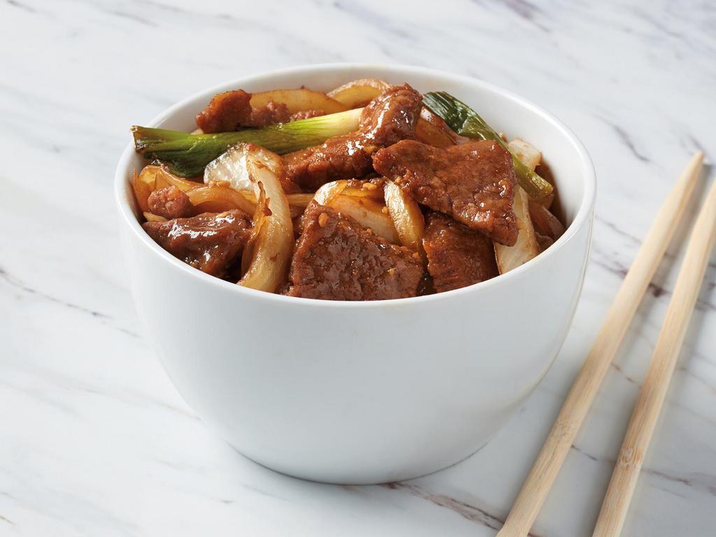 Mongolian Beef · Marinated sliced beef paired with yellow onions and scallions in Mongolian sauce.
