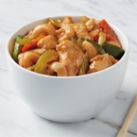 Cashew Chicken · Tender breast chicken with carrots, celery and zucchini sautéed in a light brown sauce. Topp...