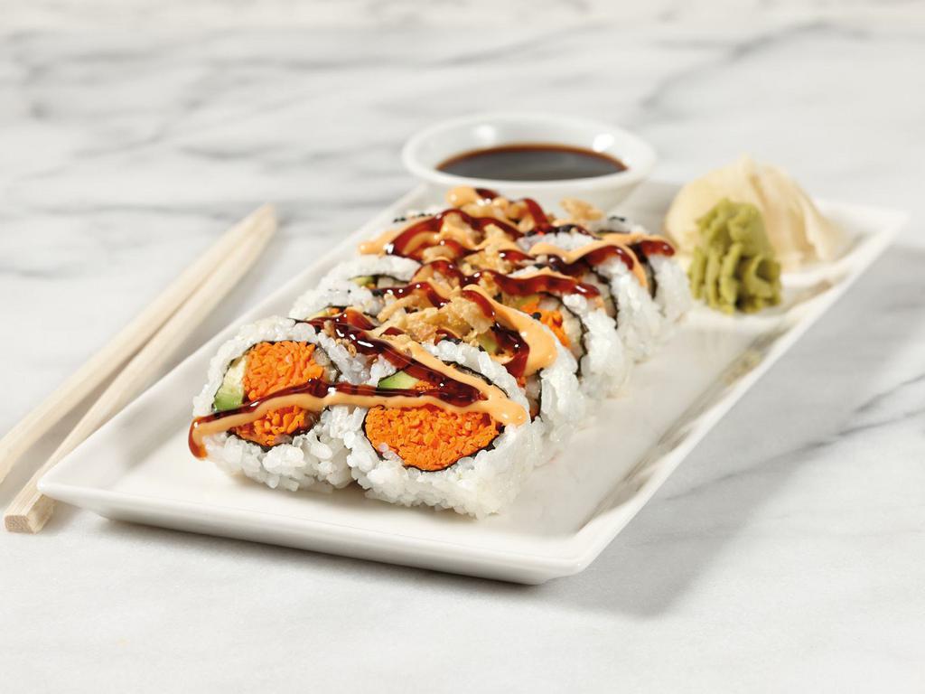 Vegetable Roll · Sushi rice, nori, roasted sesame seeds, avocado, cucumber, carrot, soy sauce, ginger, and wasabi. 10 pieces.